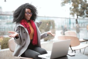 Female founder working from a beautiful location and using a virtual workspace