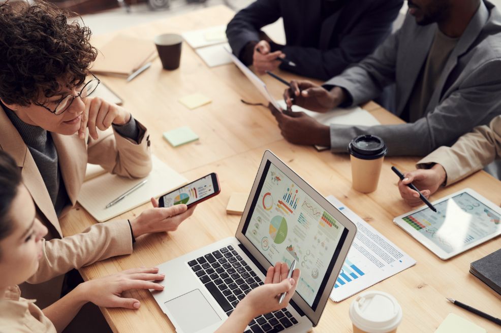 People sitting around a table working together.