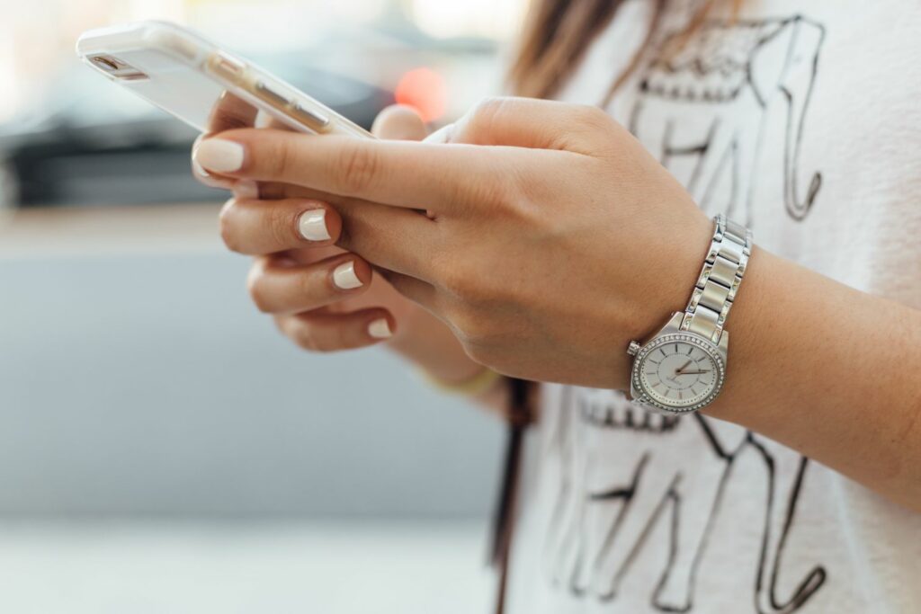 Female hands holding a phone