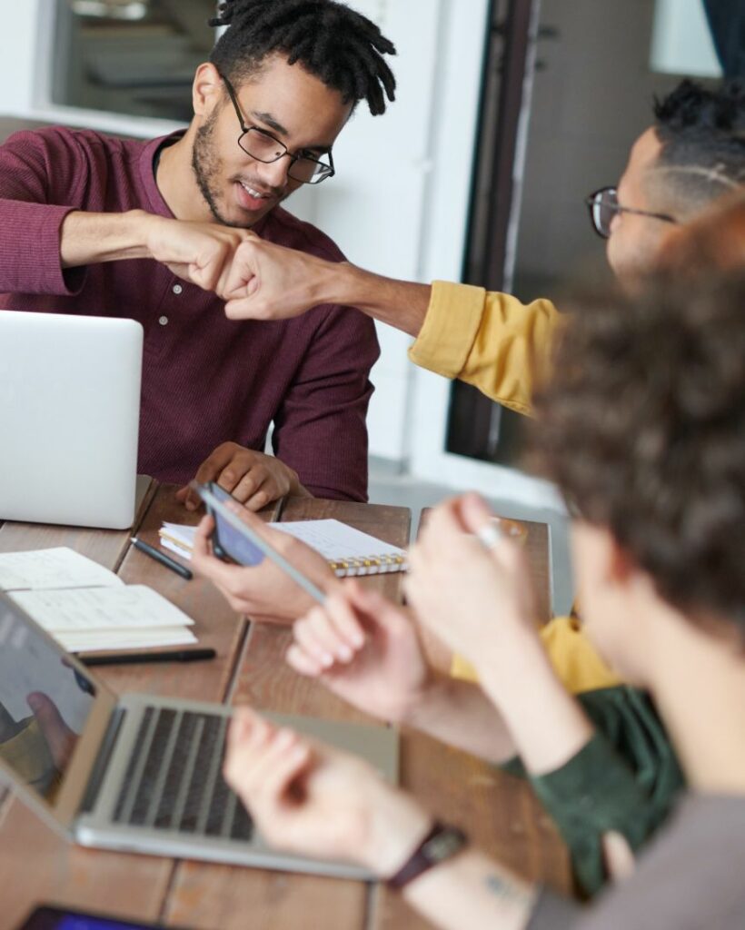 People with laptops collaborating